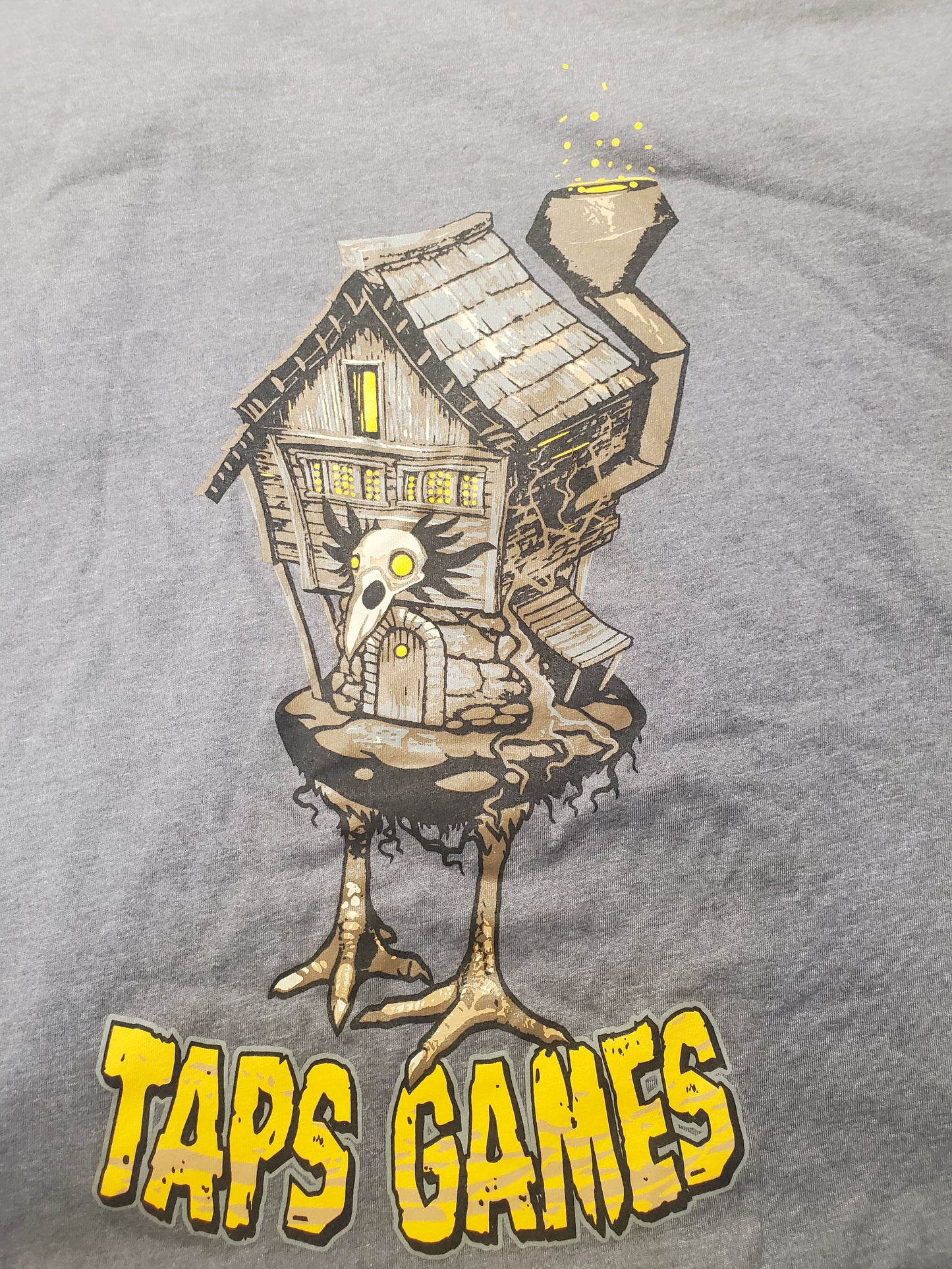 Taps Games "Babayaga House" T-Shirt (Grey) Apparel & Merchandise Taps Games