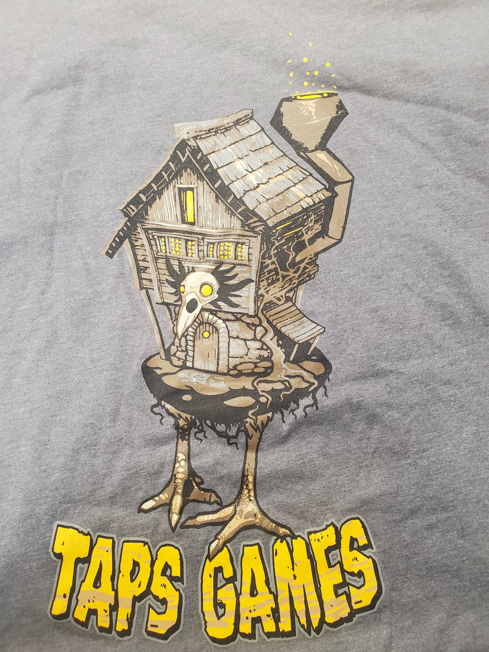 Taps Games "Babayaga House" T-Shirt (Grey) Apparel & Merchandise Taps Games   