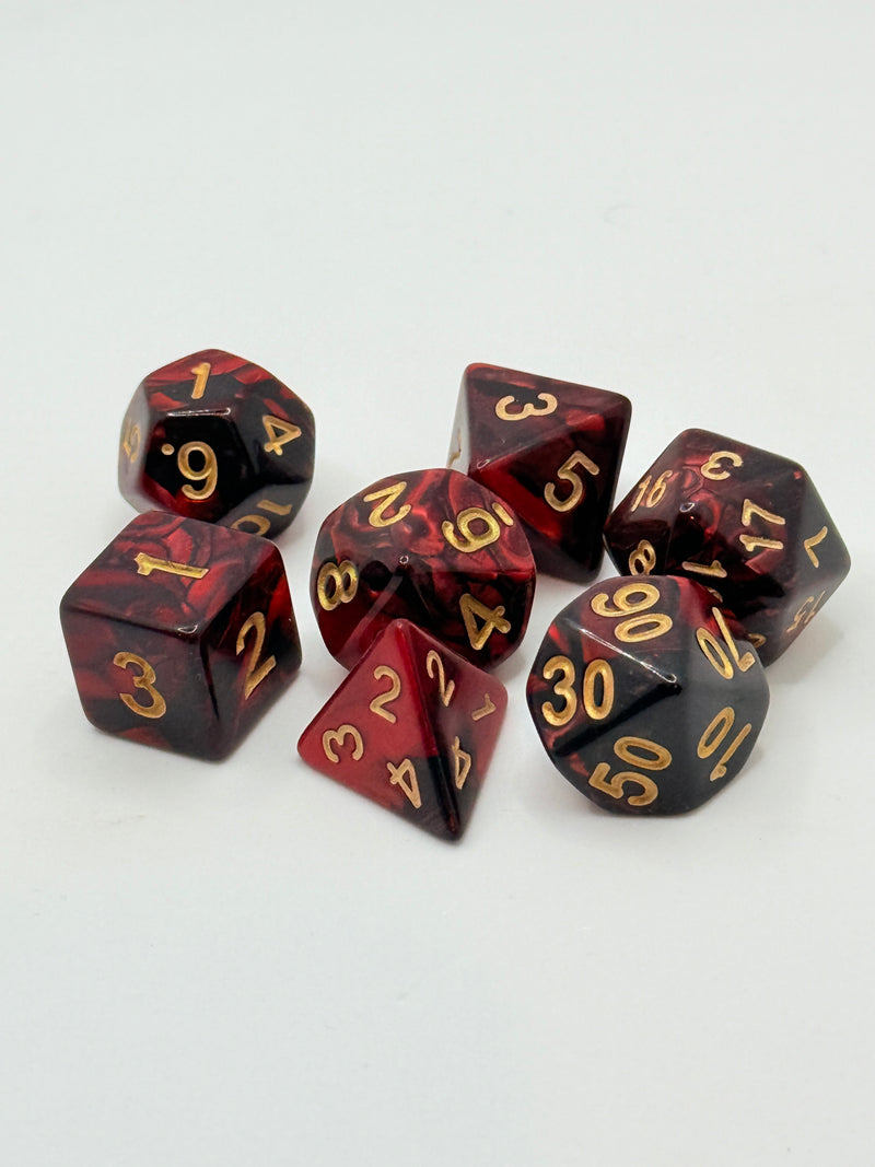 Taps Games: Opaque 7-Die Set Red Black / Gold "Firestorm" Dice & Gaming Accessories Taps Imports