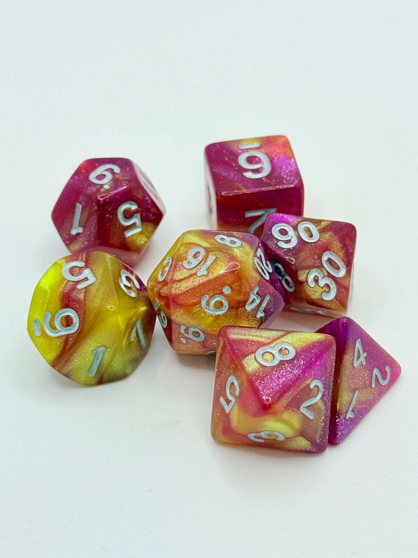Taps Games: Sparkle 7-Die Set Yellow Pink / White "Zultanite" Dice & Gaming Accessories Taps Imports