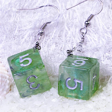 D6 Galaxy Earrings: Green & Purple Apparel & Merchandise Foam Brain Games   